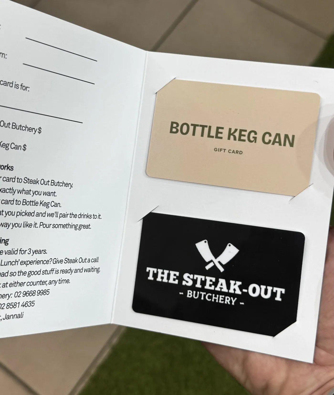 Inside the wallet: a Bottle Keg Can gift card and a Steak-Out Butchery gift card